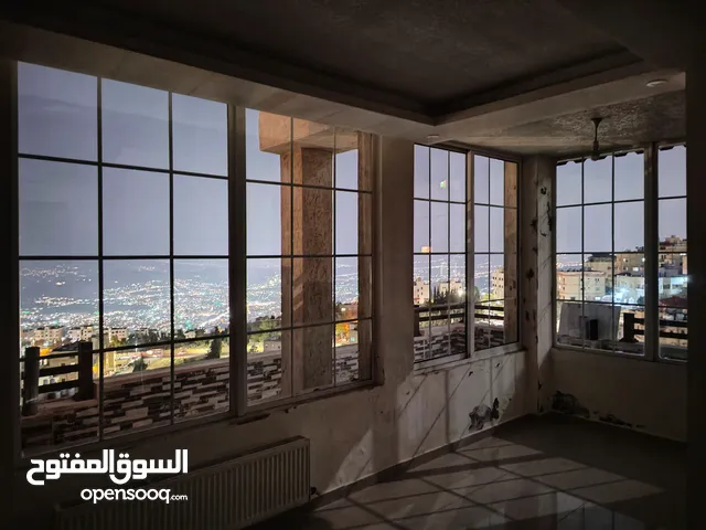 شقة  باطلالة خلابة على جبال السلط بالقرب من قصر الحمر في ميسلون   ممكن قبول نصف الثمن أرض في عمان