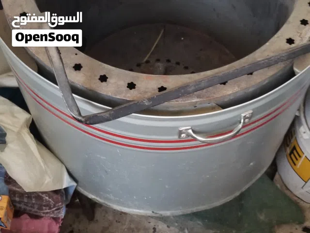 تنور حجم وسط مع الحامل حديد