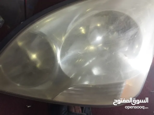 نور امامي جهة يسار لكسز 2003