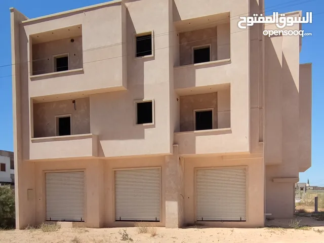 مبنى نص تشطيب للإستثمار او الإجار وكل شي موضح في الصور المكان تاجوراء خلف مركز البحوث الصناعية
