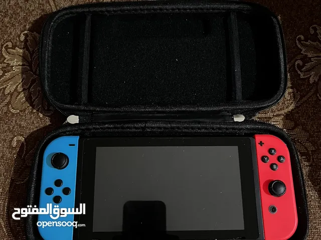 Nintendo Switch with Legend of Zelda Breath of the Wild and Legend of Zelda Tears of the Kingdom