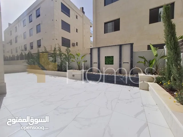 شقة ارضية مع حديقة للبيع في حي الصحابة بمساحة بناء 180م
