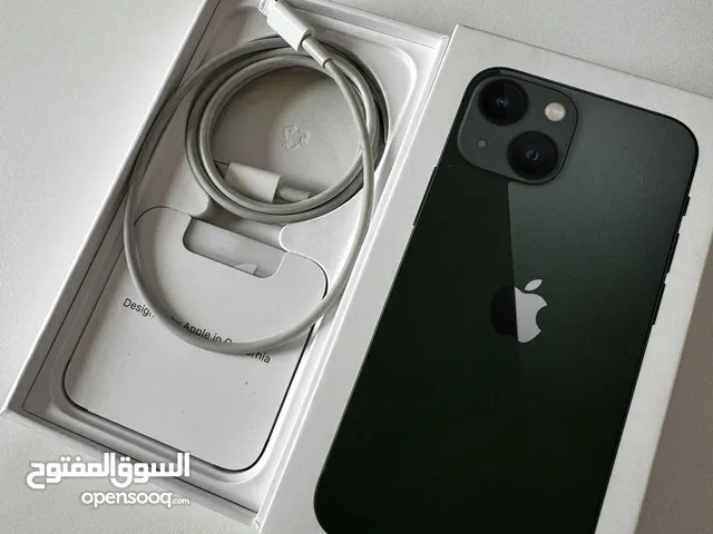 Green iPhone 13 mini + cases