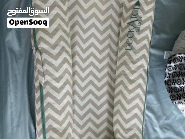 DockATot Deluxe+ Dock, Silver Lining (Chevron) baby lounger.  It is designed for babies aged 0-8 mon