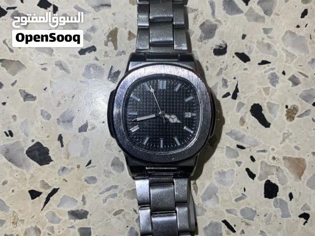 50dh ساعة معدنية جميلة و كلاسيكية