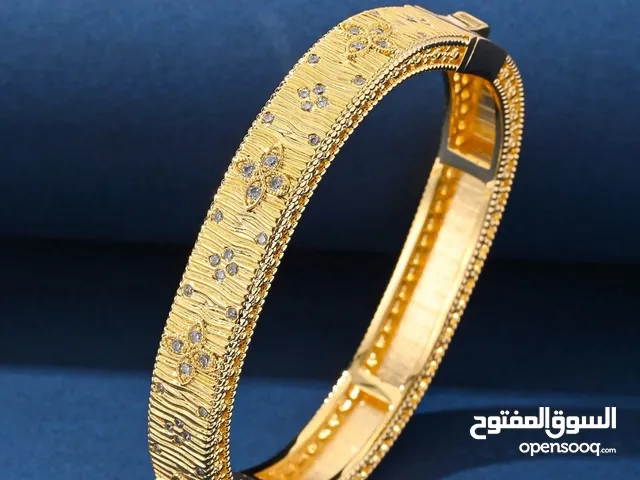 Elegant Gold Bangle with Floral Design