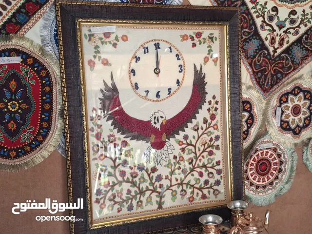 ساعة حائط مطرزة يدويًا بتصميم نسر صناعة إيران – كرمان جودة ممتازة شحن مجاني استرجاع مضمون