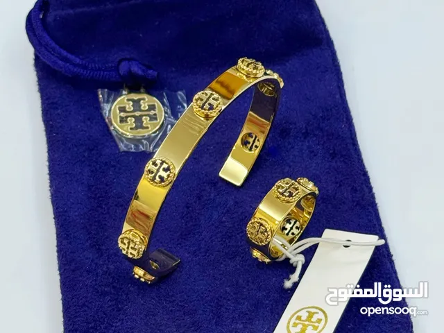 سوارة اصلية مع خاتم اصلي جديدة من tory burch