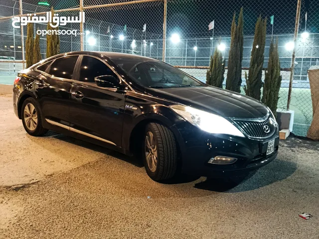 للبيع هيونداي أزيرا غراند هايبرد كرت 2014 لون أسود ملكي مع إضافات
