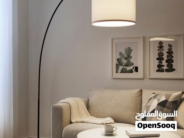 IKEA arch lamp with navy blue lampshade