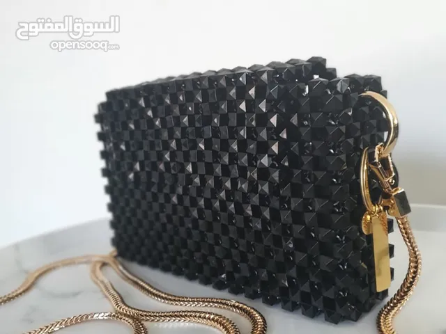 Elegant black studded clutch bag for sale