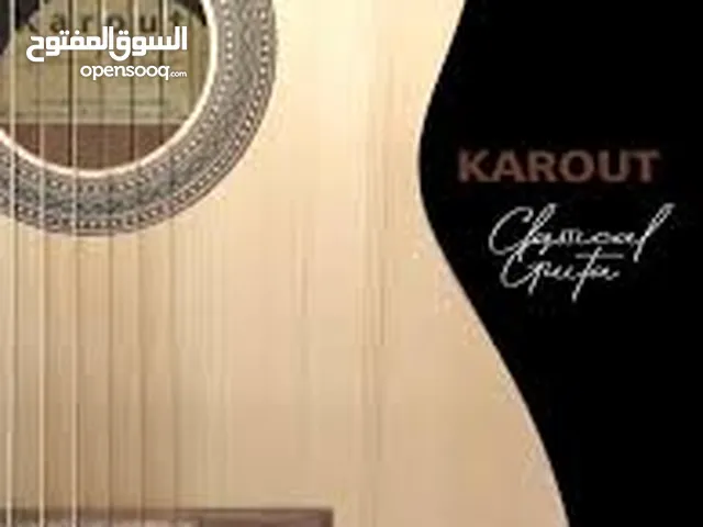 guitar carot handmade  demcuce جيتار صناعه سورية استخدام فترة بسيطه  الجيتار روعه وصوته ممتاز