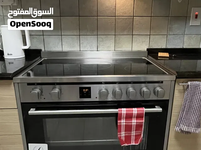 Electric cooking range and oven