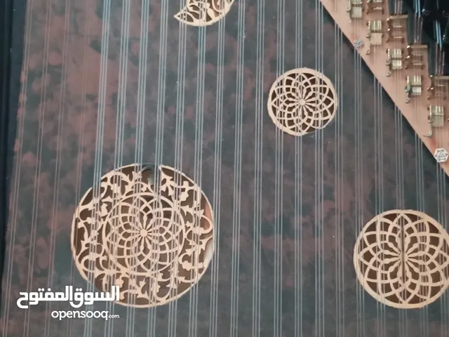 الة موسيقية . قانون