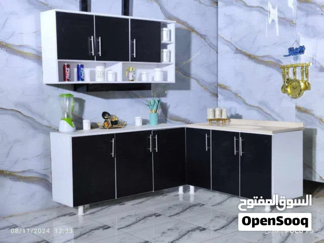 كاونتر خشب ام دي اف.   قياس مترونص  ارضي وملحق متر ونص  وسنك متر وعشرين.