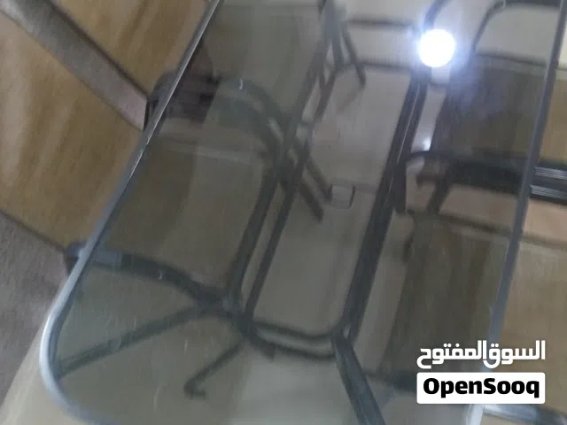 طاوله طعام مع أربع كراسي زجاج سكريت