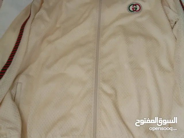 How cool is this jacket with trousers from Gucci! It is sewn using cream tricot fabric, with a GG pa