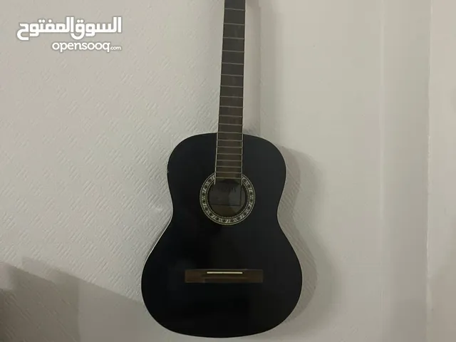 carlos guitar and stand