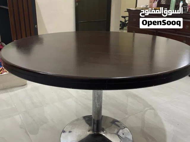 Round wooden dining table for sale