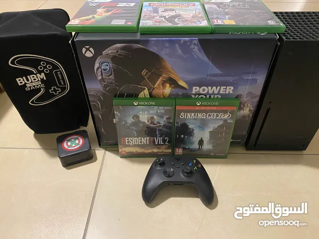 Xbox series X with 5 games and charger port and cover for the xbox