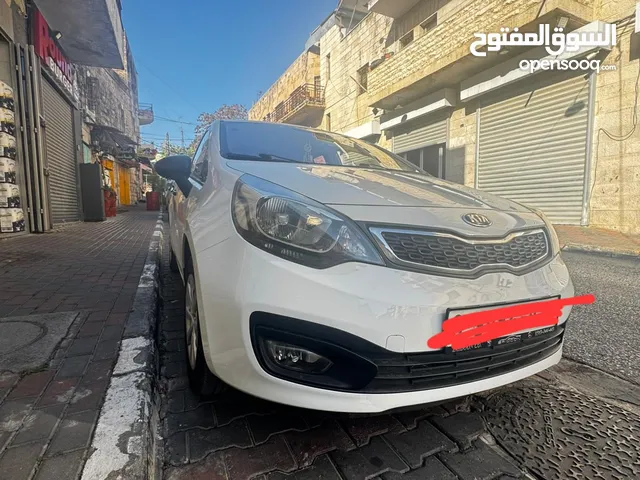 كيا برايد 2014 لون ابيض السيارة ماشا لله مش ناقصها شيء ماطور 1400 4 غيار السيارة البيع فقط كاش.