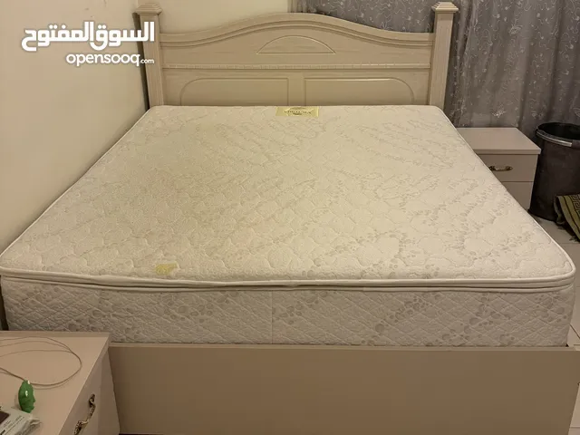 White/beige king sized bed + AlBaghli Victoria pillow top mattress.