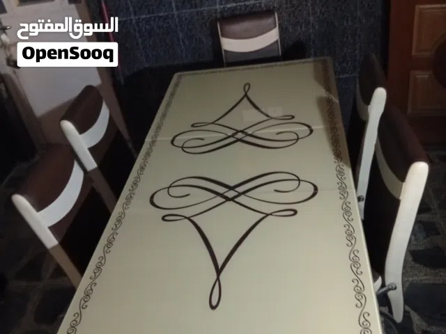 ميز طعام زجاجي