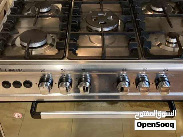 طقم كنب 7 مقاعد حاله الجديد وغاز بحاله ممتازه و متيكروويف