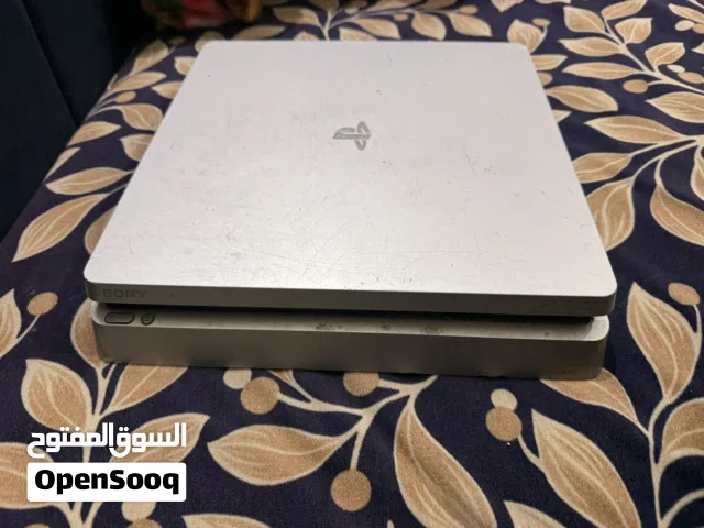 PlayStation 4 with two controllers