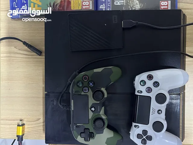 PlayStation 4 with two controllers and four games and extended hard drive