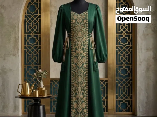 فستان ( زمردة التراث )الأخضر بتطريز ذهبي فاخر