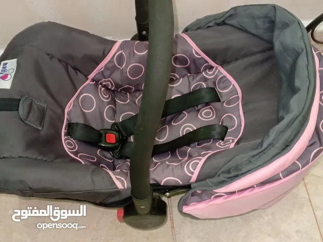 عرباية اطفال juniors باللون الاخضر والرمادي + كوت اطفال باللون الوردي والرمادي