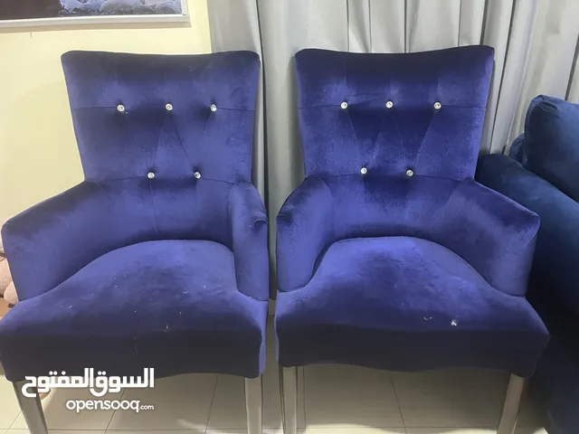Four seater sofa with two matching chairs for sale