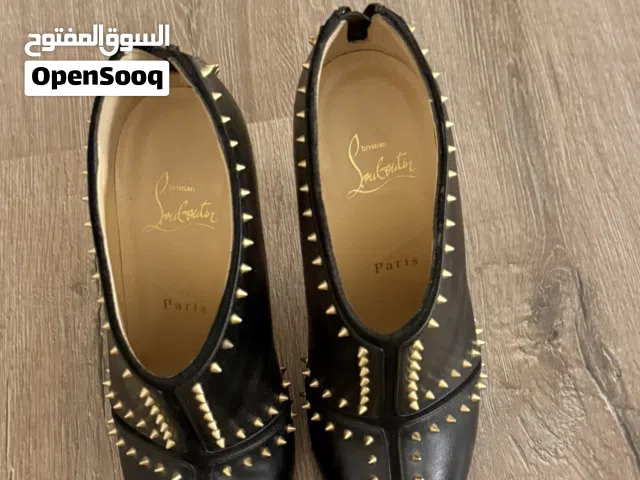 } Authentic Christian Louboutin spike heels.