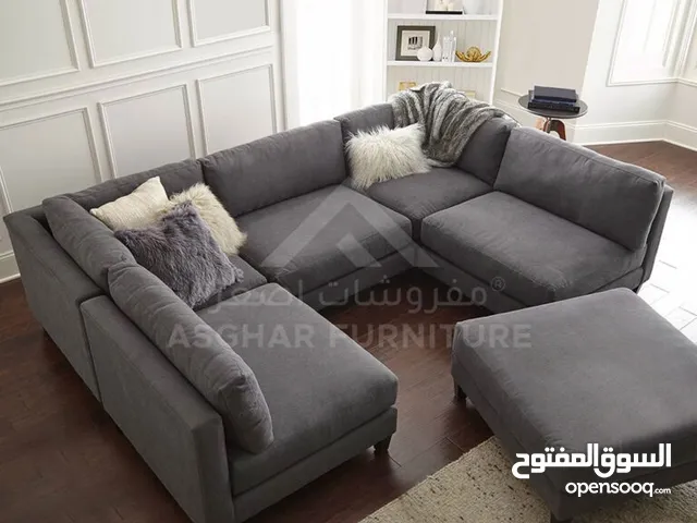 Stylish sectional sofa with ottoman in grey