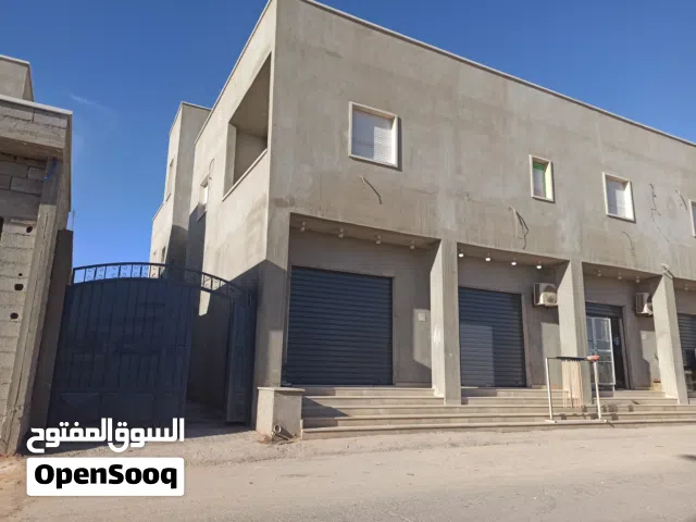مبني استثماري للبيع  محلات شقق .. مكان بنغازي الهواري شارع كتربيل . عل قطران ...بالقرب من مدرسه عامه