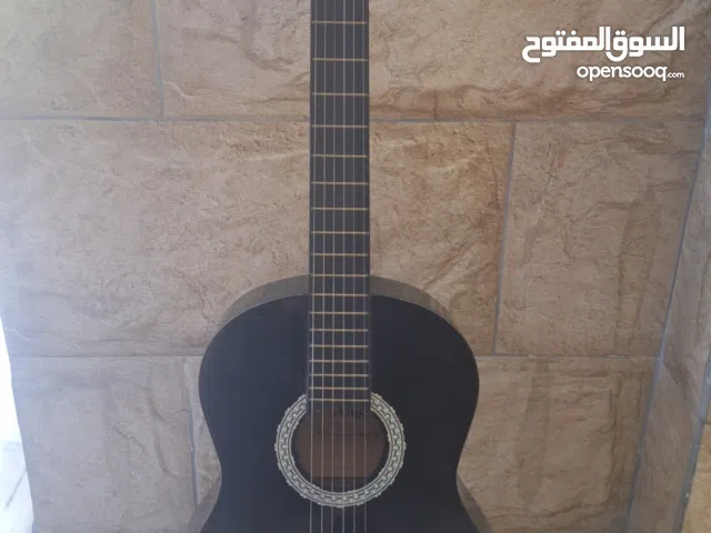 Black Angel Classical Guitar - Includes bag and picks - very good condition