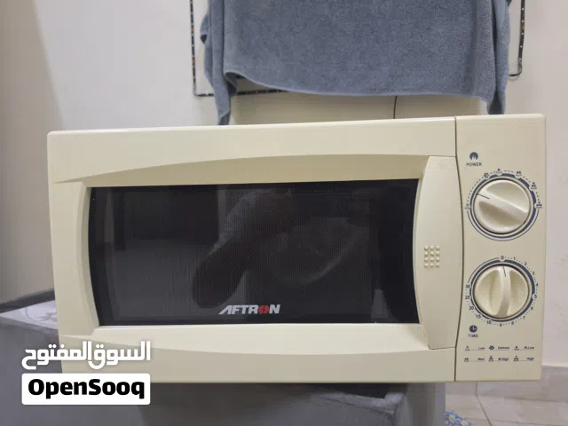Aftron brand microwave, 20-liter capacity, very clean, like new.