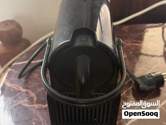 ماكنه Nespressoكبسولات+جهاز الحليب للرغوه والتسخين