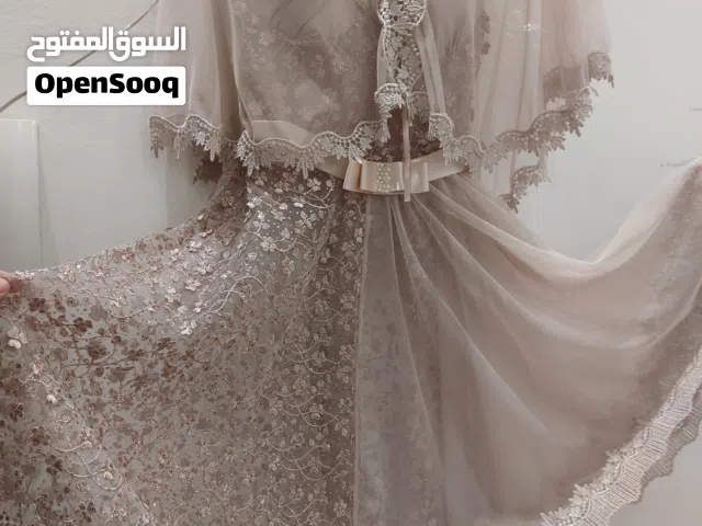 فستان بنفسجي وفستان عرايسي