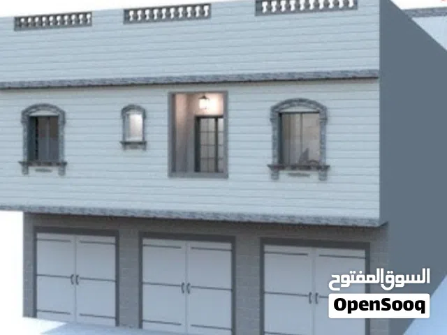 قطعة أرض مقام عليها محلات تجارية للبيع في طريق السور موقع حيوي ممتاز