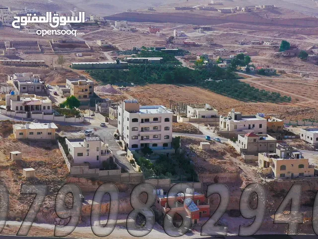 قطعة ارض على شارع 14 مرتفعة ومطلة قرب طريق عمان التنموي