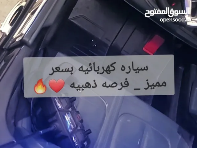 "سيارة أطفال كهربائية 12 فولت – شحن – ريموت للوالدين – أبواب تفتح – LED وموسيقى-شاحن "