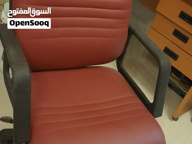 Office desk and a leather chair for sale.