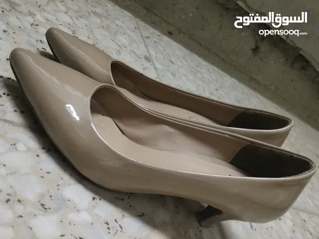 Beige With Heels in Baghdad