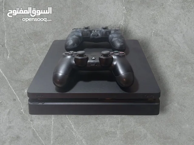 PlayStation 4 Slim with 2 controllers and 2 games which are Nba2k23 and fifa 20 with charger