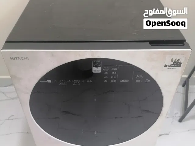 للبيع غسالة هيتاشي أوتوماتيك فيها مشكله الدرام Hitachi automatic front-load washing machine, 12 kg