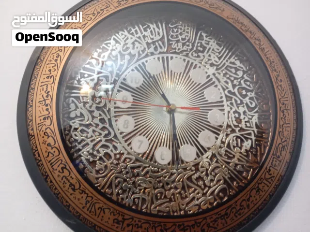 ساعة حاءطية مرصعة باايات قرءناية كورية الصنع