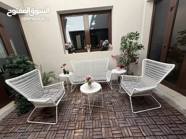White garden furniture with plants from Ikea