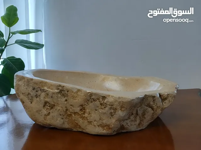 Handmade natural stone wash basin — unique, durable, and full of character